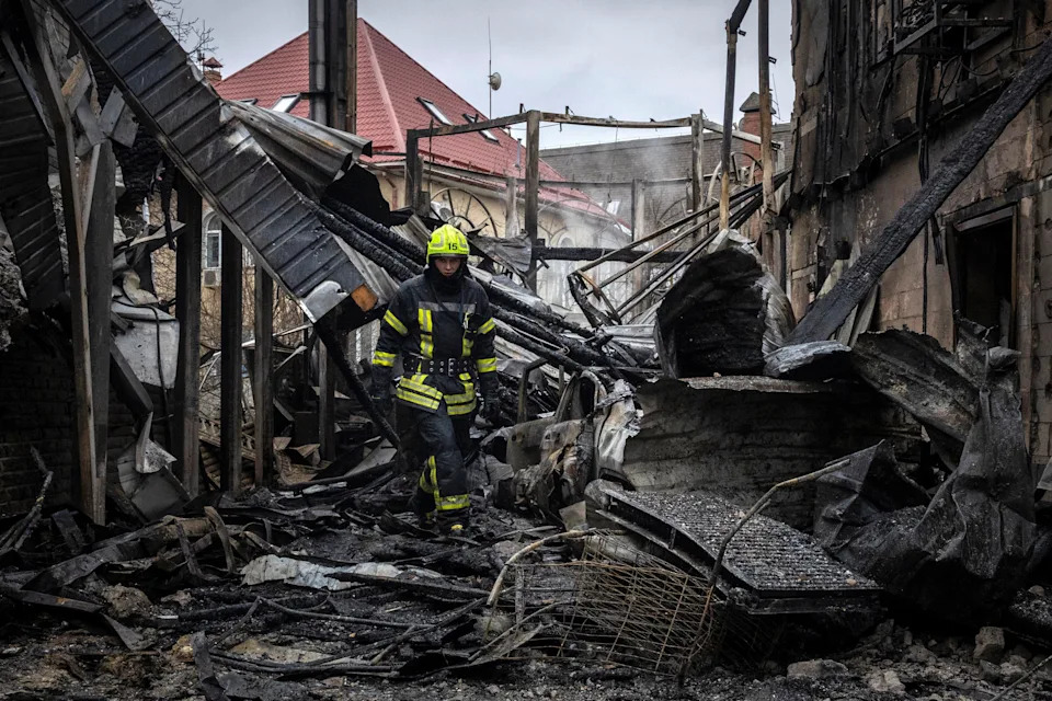A firefighter walks at the site where a Russian drone struck a residential building during a night of Russian drone and missile attacks, amid Russia's attack on Ukraine, in Kyiv, Ukraine December 27, 2025.