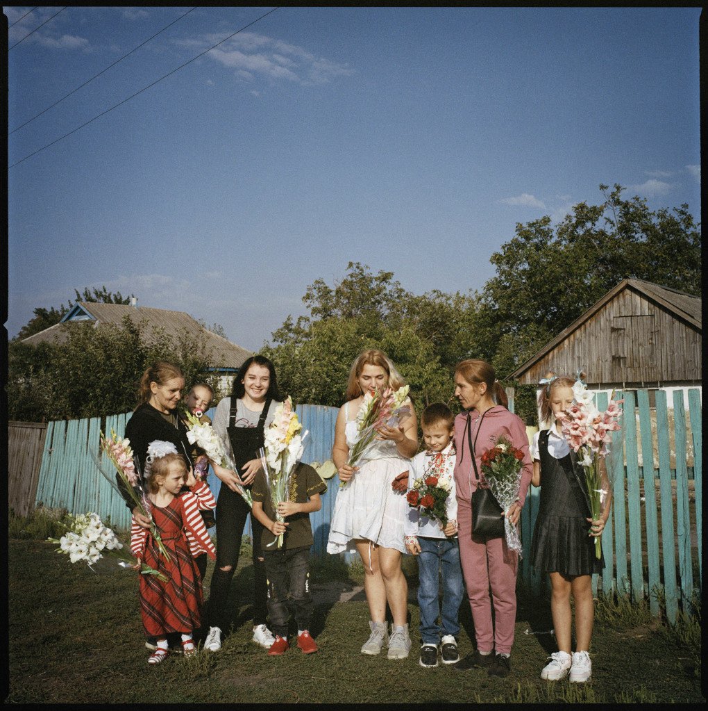The Hrynyks' extended family gather before the first day of school in the Poltava region, 2024.From the series 5K from the Frontline. (Image: Anastasia Taylor-Lind)