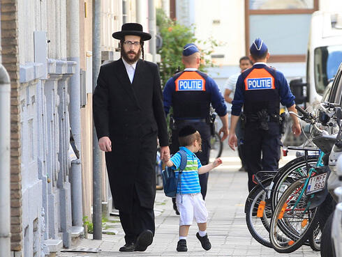 Belgium to keep heightened police security in Antwerp’s Jewish neighborhoods