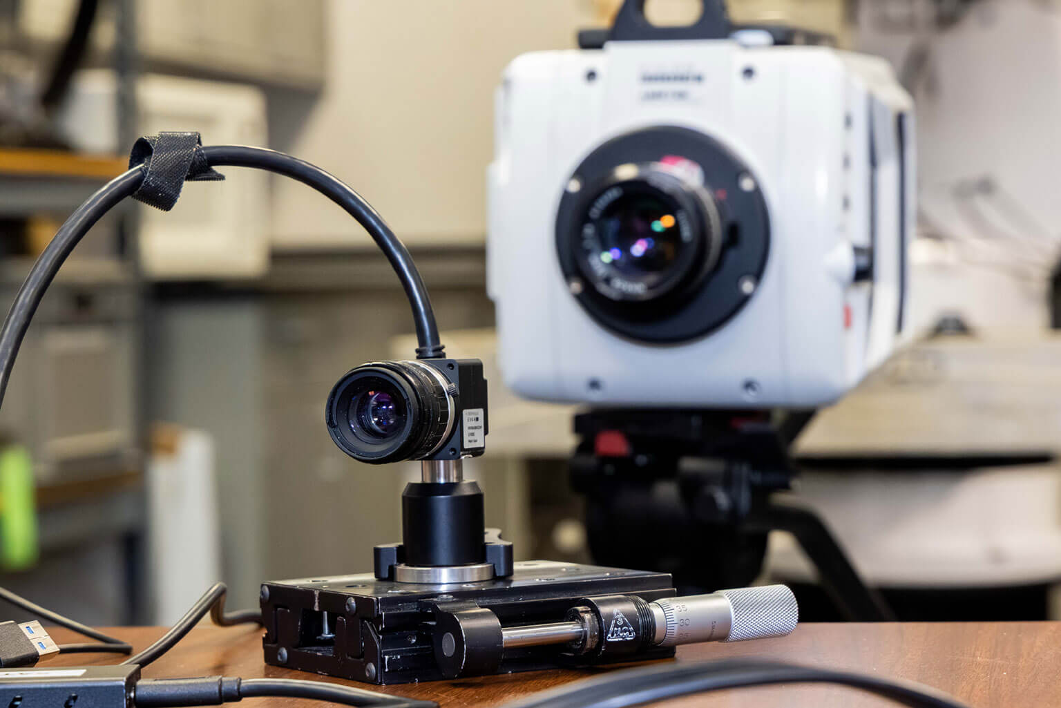The $4,500 event-based camera, foreground, has the same effective capability as the Phantom camera, in monitoring the geospace environment, Space Physics and Atmospheric Research Center.