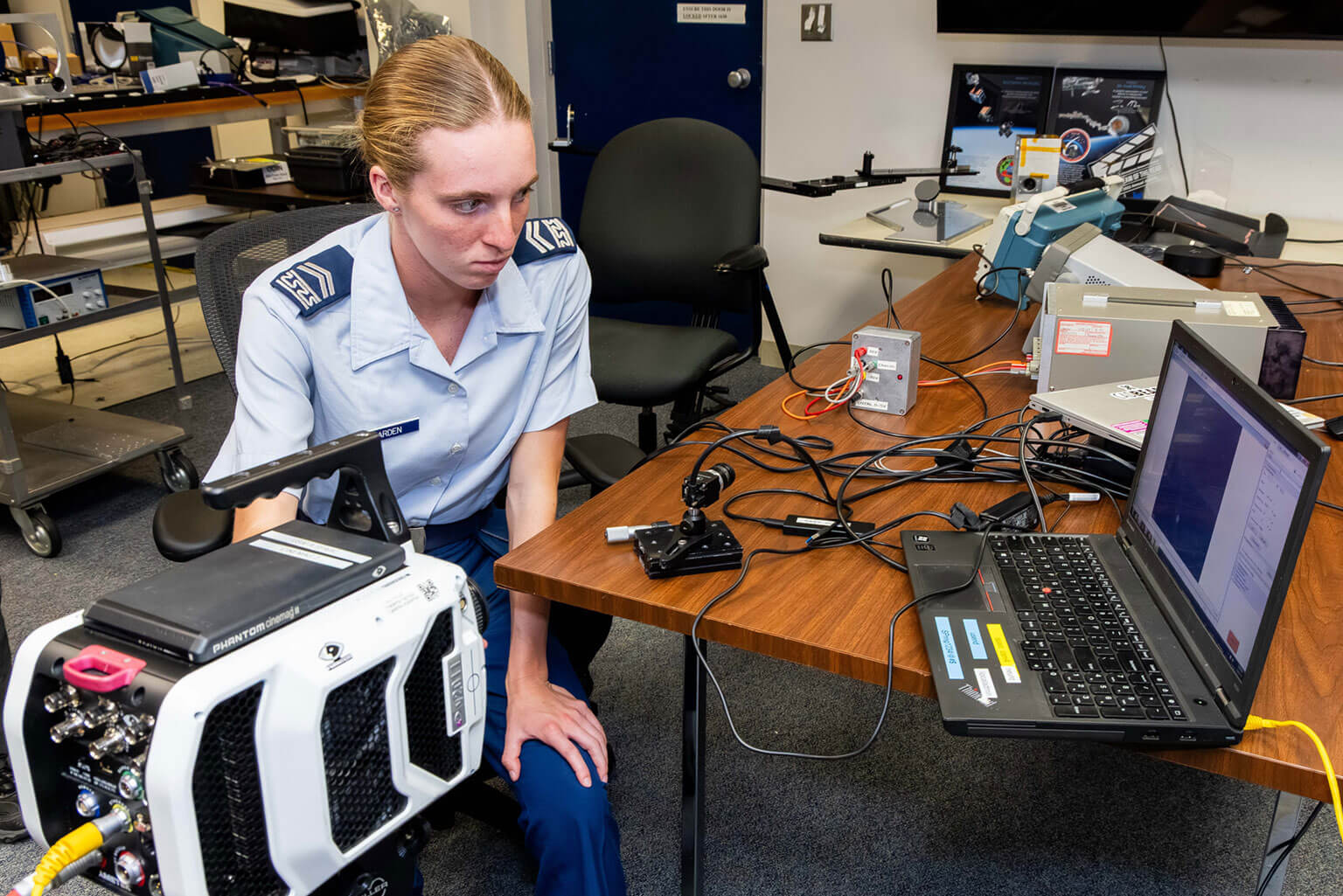 Cadet 2nd Class Anna Harden compares the high-speed Phantom camera, left, with the event-based sensor camera, right, Space Physics and Atmospheric Research Center.