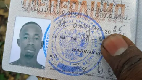 Kuloba family A close-up of David Kuloba's Russian military ID showing his photo and an official stamp.