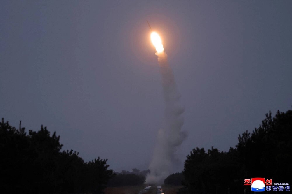 North Korea's Kim views test-firing of long-range missile
