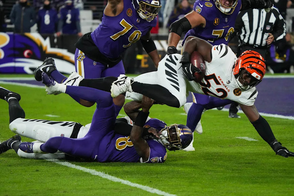 Bengals linebacker Cedric Johnson recovers a fumble by Ravens quarterback Lamar Jackson in the Thanksgiving night game. It was one of five Ravens turnovers.