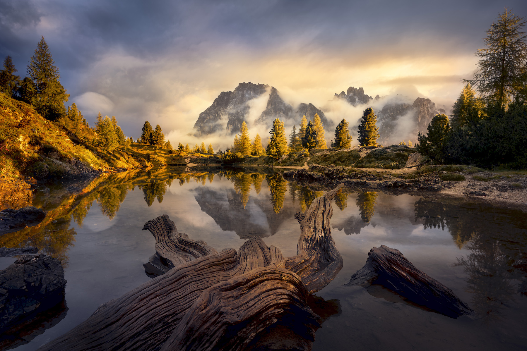 misty lake with mountains and lake and evergreen trees