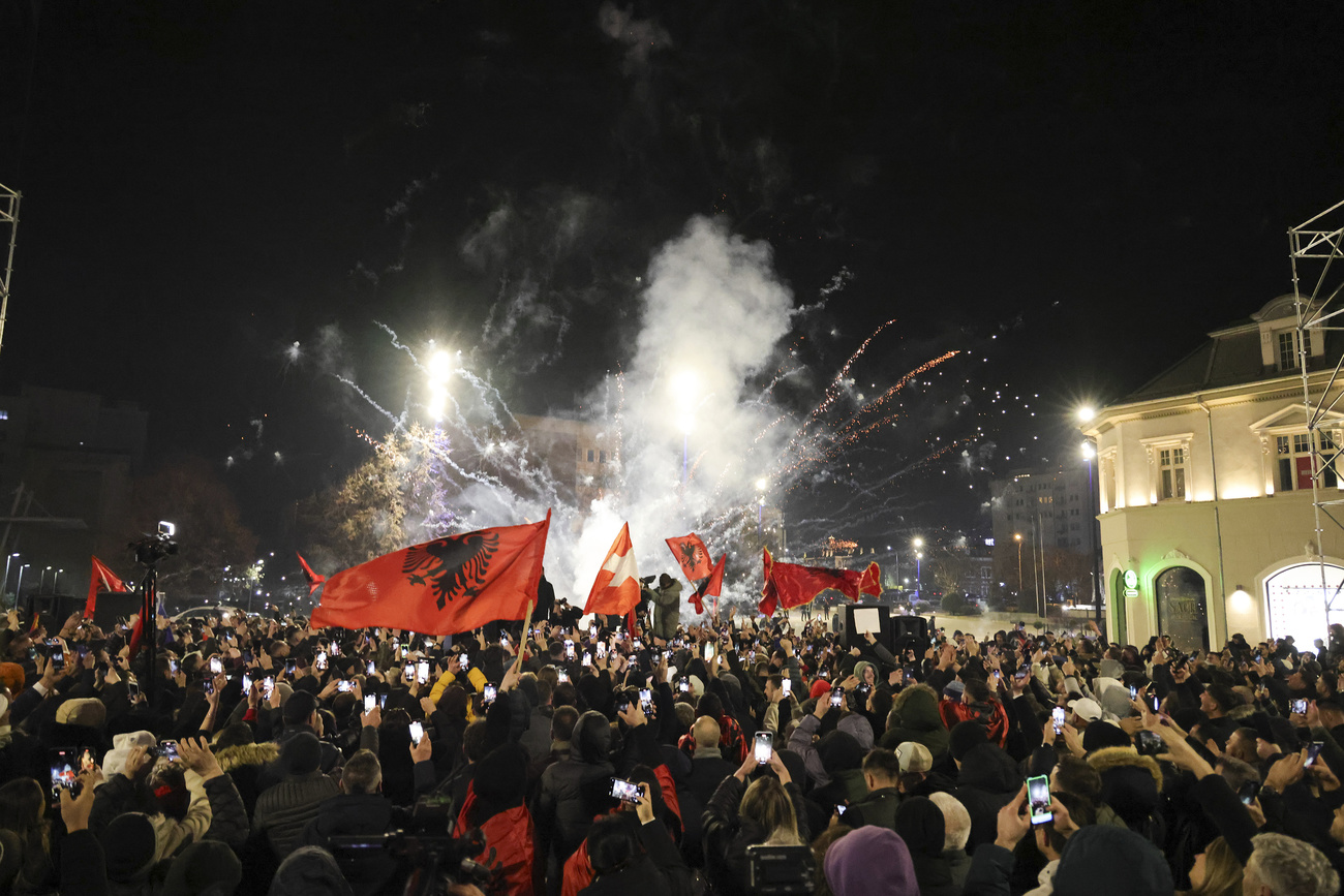 Supporters of left-wing Vetevendosje! party celebrate following results of a parliamentary election, in Pristina,