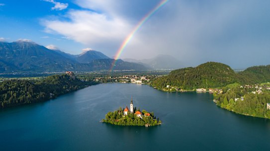 Somewhere and a rainbow – Lake Bled, the island and the alps.