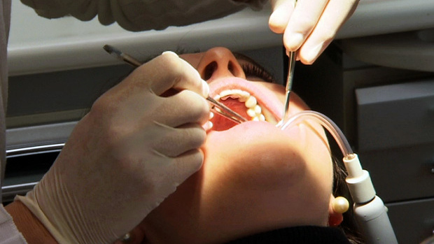 Police raid dentist suspected of billing for fictitious services