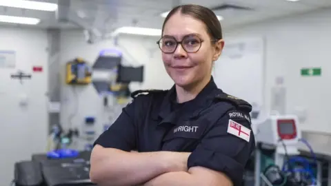 Royal Navy Portrait of Leading Naval Nurse Abigail Wright standing in a medical room