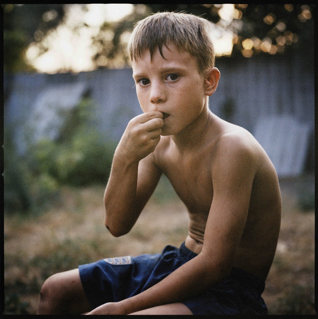 One of the boys in the Hrynyks' extended family at Olha’s new home in the Poltava region, 2024. From the series 5K from the Frontline. (Image: Anastasia Taylor-Lind)
