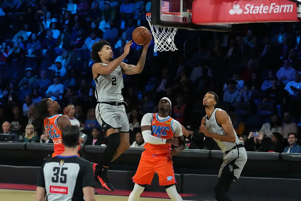 Dec 13, 2025; Las Vegas, Nevada, USA; San Antonio Spurs guard Dylan Harper (2) goes to the basket against the Oklahoma City Thunder during the first half at T-Mobile Arena. Mandatory Credit: Kirby Lee-Imagn Images