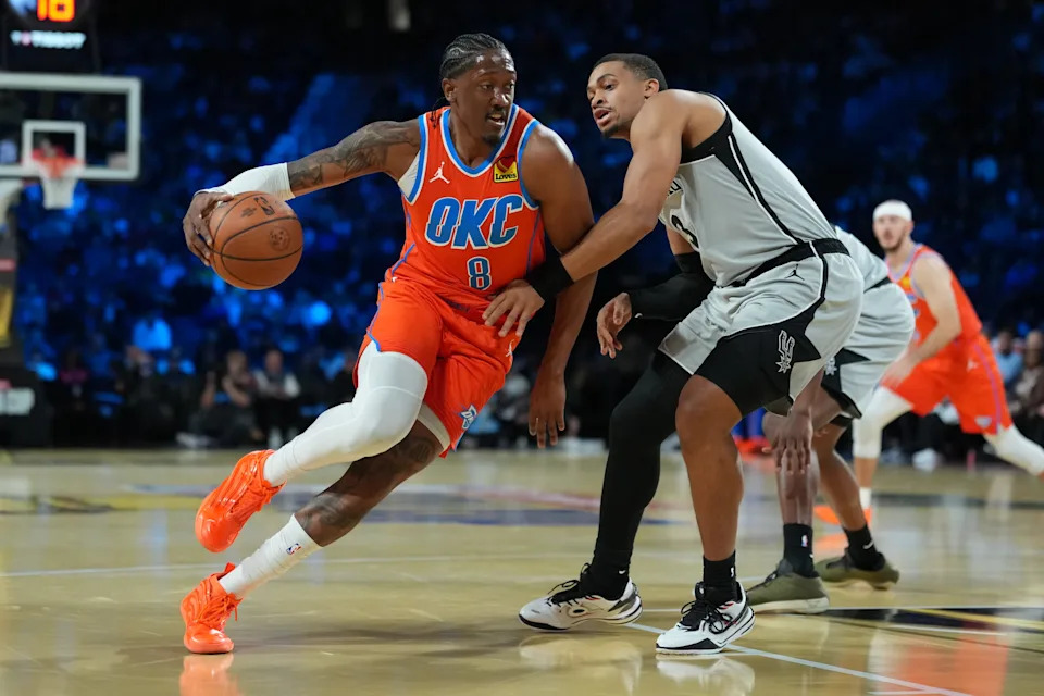 Dec 13, 2025; Las Vegas, Nevada, USA; Oklahoma City Thunder guard Jalen Williams (8) grabs the loose bal in front of San Antonio Spurs forward Keldon Johnson (3) during the first quarter at T-Mobile Arena. Mandatory Credit: Kirby Lee-Imagn Images