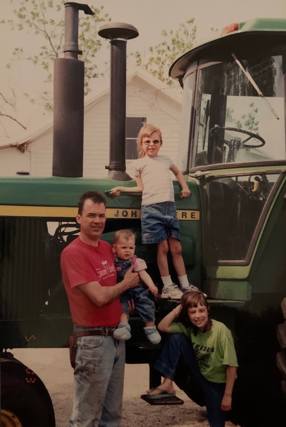 Tim Yerkey with his daughters Emma (baby), Claire (on top step), and Allison Yerkey (on bottom...