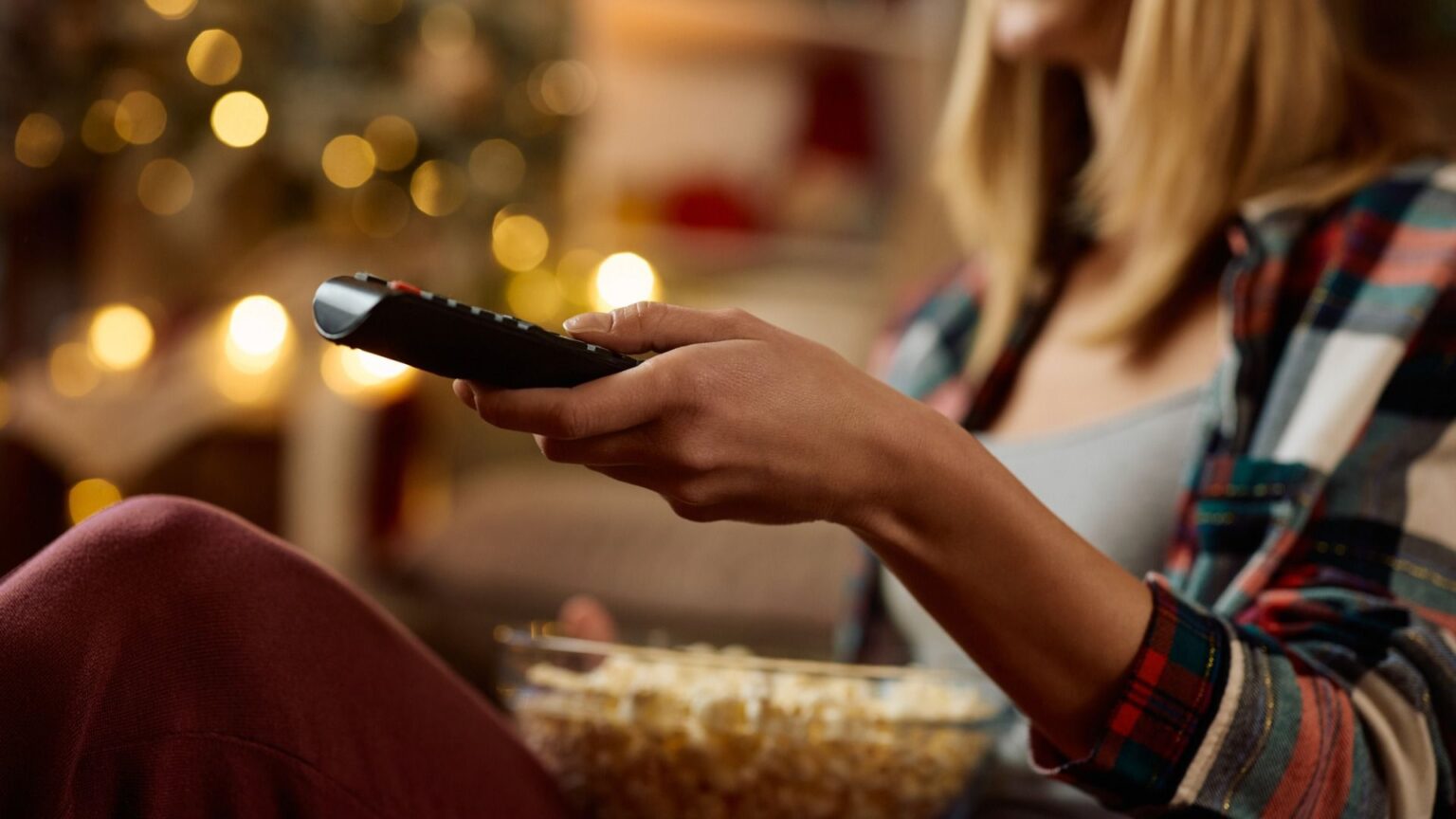 Lady watching TV at Christmas