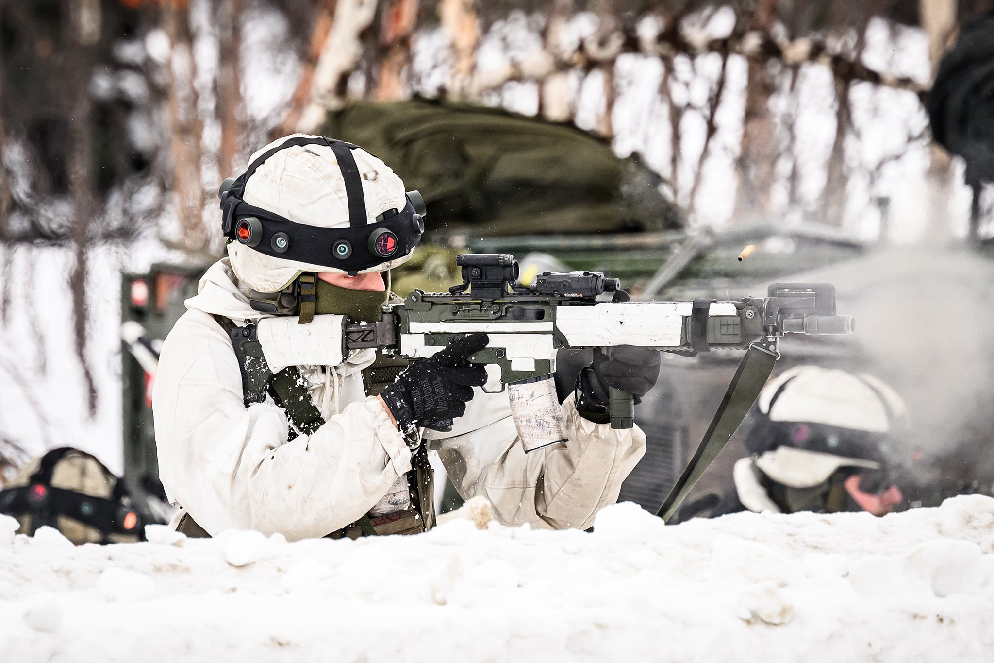 A Swedish soldier takes part in an exchange of fire during drills