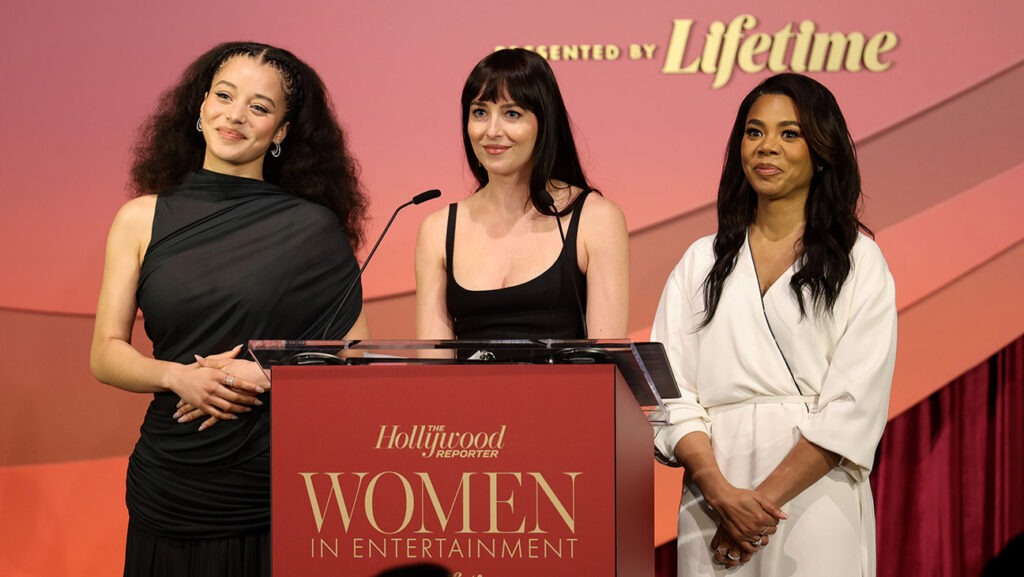 (L-R) Chase Infiniti, Dakota Johnson, and Regina Hall speak onstage during The Hollywood Reporter Women In Entertainment Presented By Lifetime at The Beverly Hills Hotel on December 03, 2025 in Beverly Hills, California.