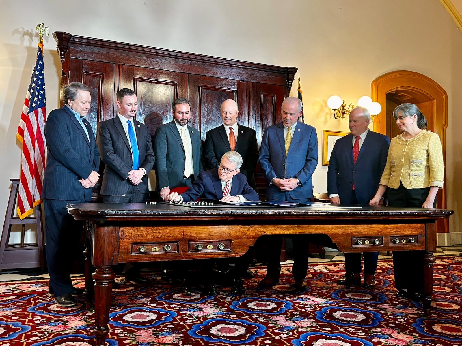 Ohio Gov. Mike DeWine signs a series of bills meant to address rising property taxes in Ohio on Dec. 19, 2025.