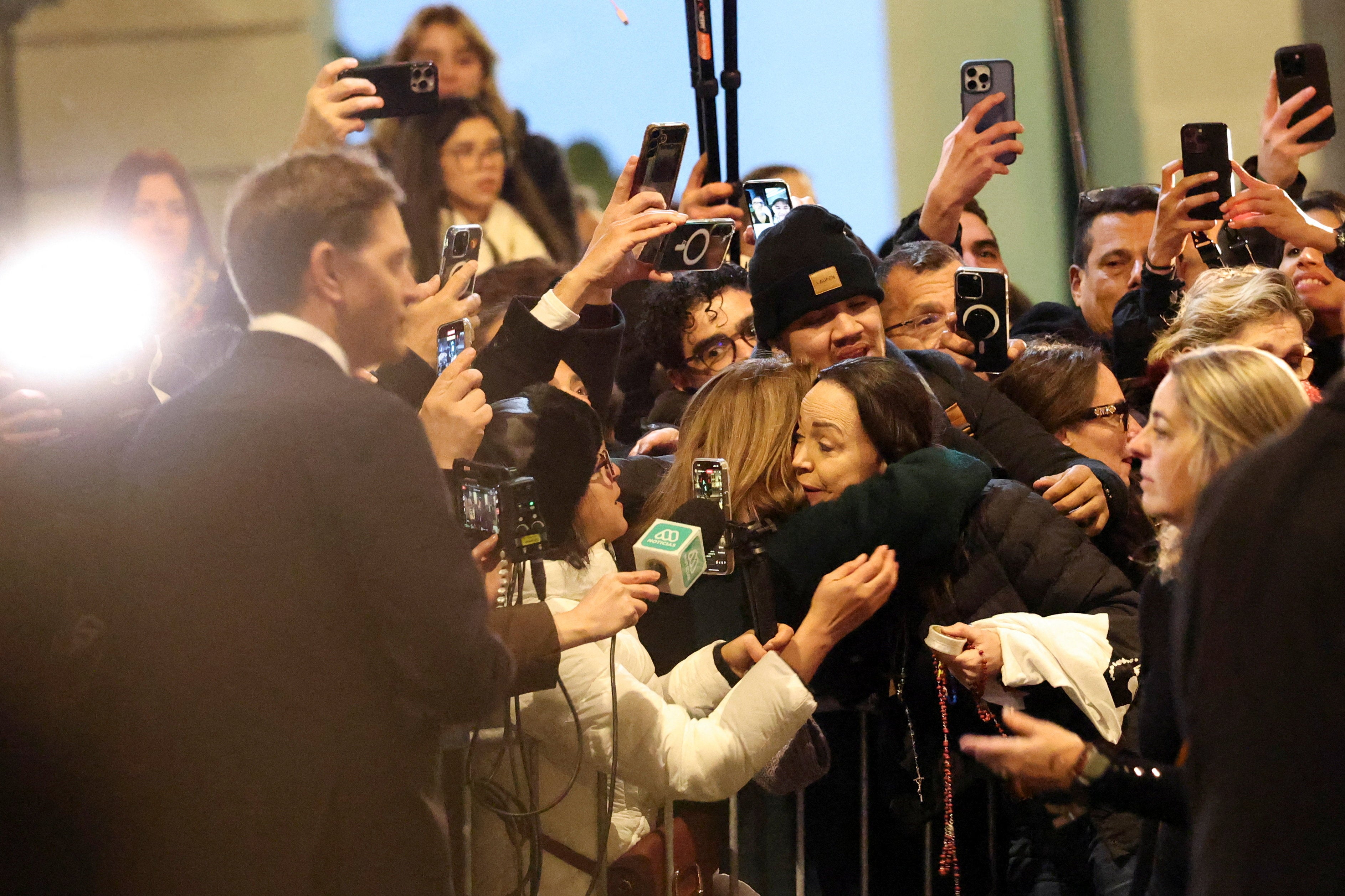 Machado is hugged by a supporter as she greets people on the streets of Oslo