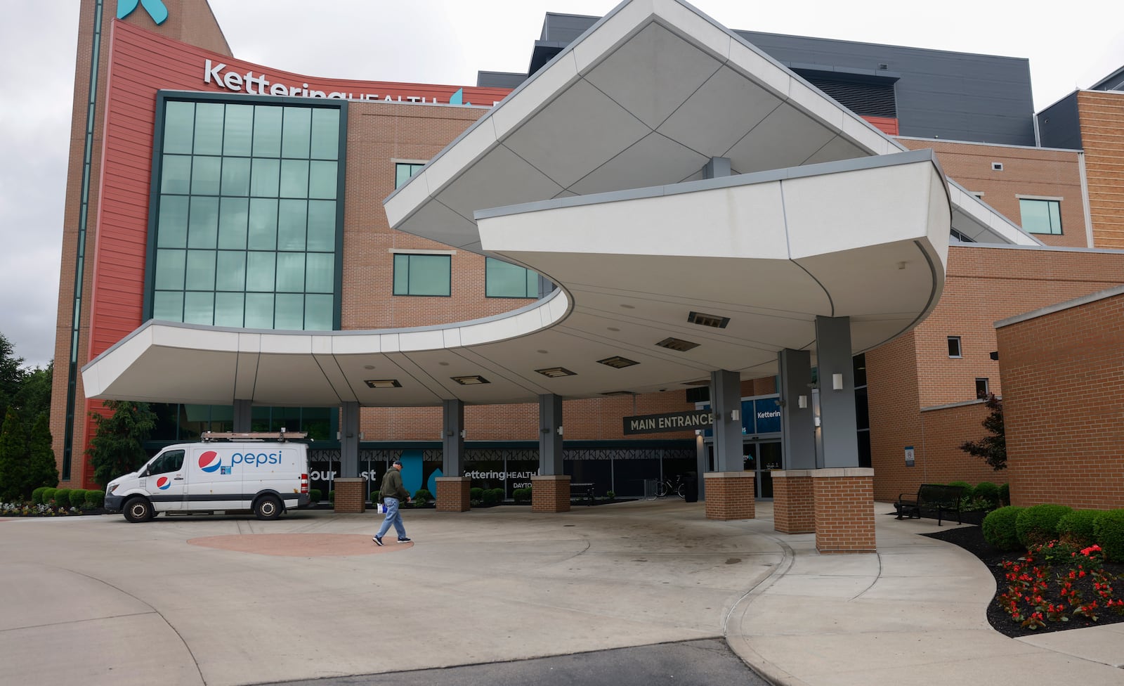A man prepares to enter Kettering Health Dayton on Thursday, May 22, 2025. JOSEPH COOKE/STAFF