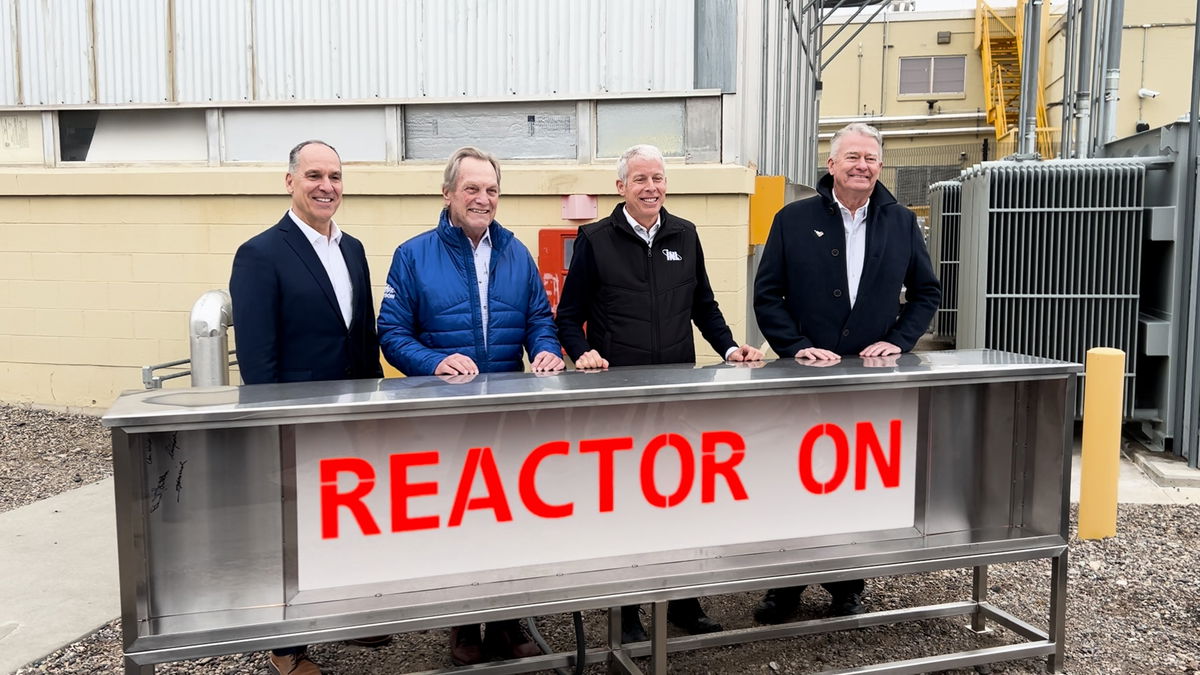 INL Director John Wager, U.S. Representative Mike Simpson (R-Idaho), U.S. Secretary of Energy Chris Wright and Governor Brad Little stand next to the DOME microreactor test bed at INL on Monday.