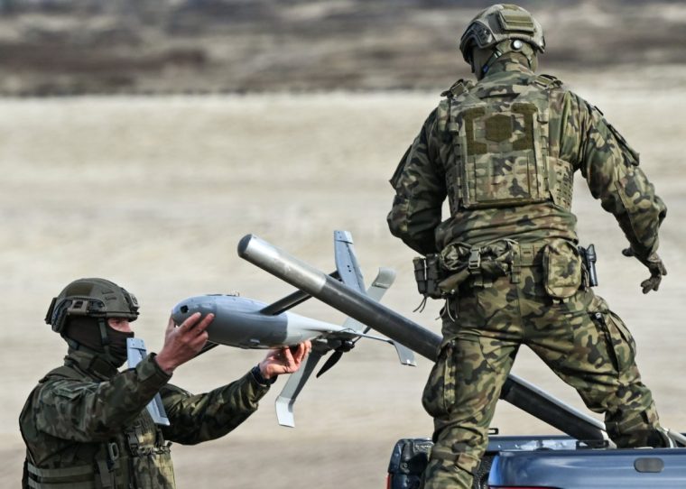 DEBA, POLAND NOVEMBER 18: A Polish Army soldier prepares an AS3 Surveyor interceptor drone, part of the U.S. counter-drone system known as 'MEROPS,' during a live-fire demonstration at the Deba training grounds in Subcarpathian Voivodeship, Poland, on November 18, 2025. The drill is part of NATO's Eastern Sentry initiative to enhance vigilance and strengthen defenses against drone threats along the alliance's eastern border. (Photo by Artur Widak/NurPhoto via Getty Images)