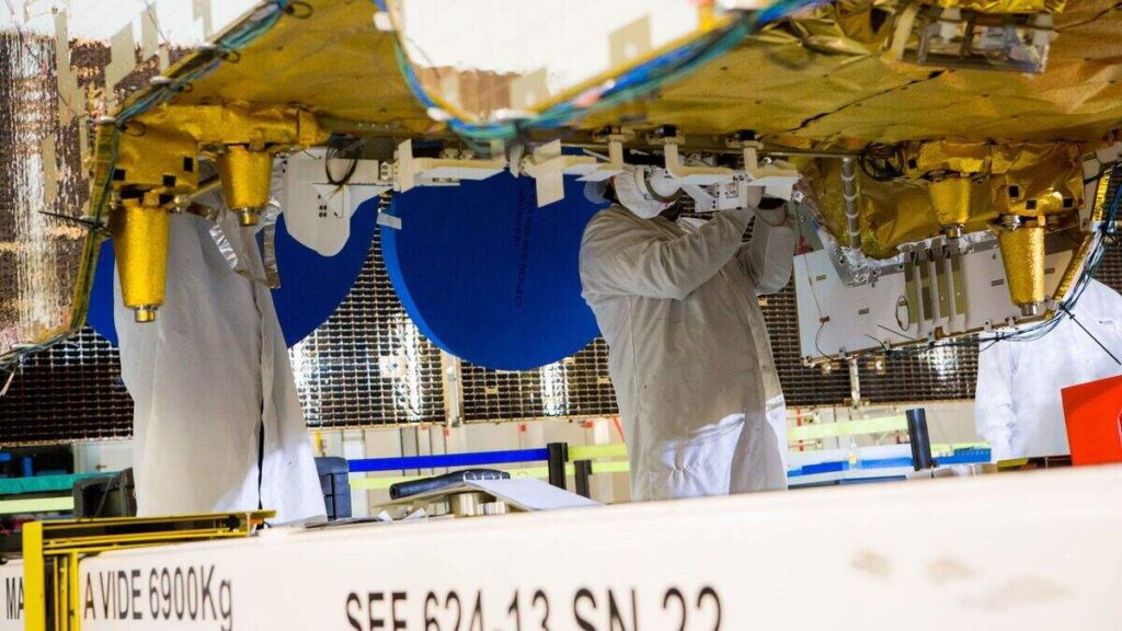 Technicians at satellite manufacturer Airbus work on an SES satellite launched in 2017 to deliver television signals to Latin America