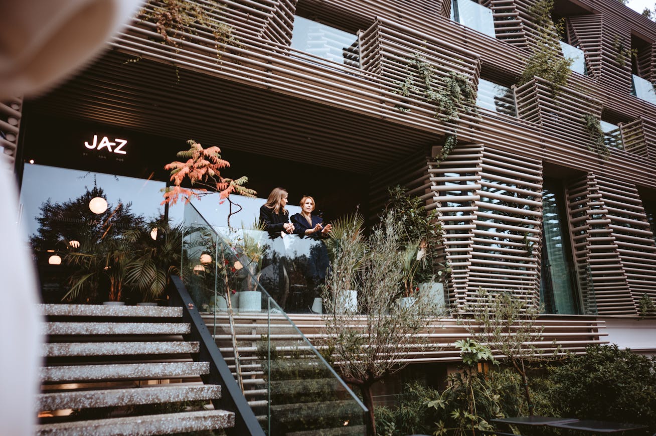 Two women in front of facade of Boutique Hotel AS, Ljubljana, Slovenia