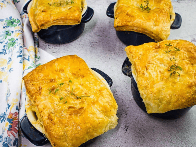 Turkey Pot Pies with Puff Pastry on a counter.
