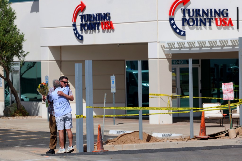 People embrace outside of the Turning Point USA headquarters in Phoenix on Sept. 10, 2025. Charlie Kirk, the CEO and Co-Founder of Turning Point USA, was shot and killed at an event in Utah. (Photo by Sydney Lovan/Cronkite News)