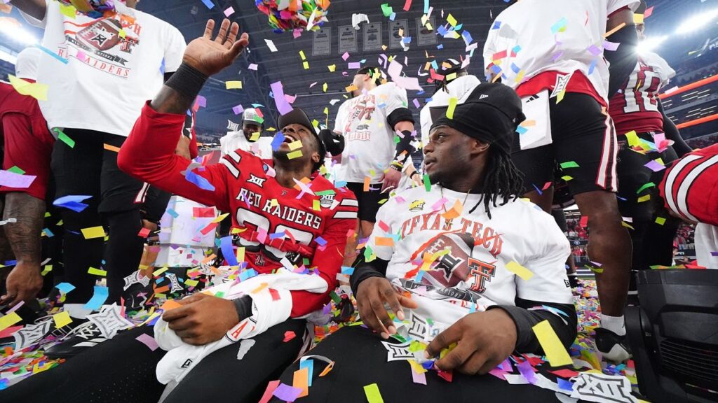 Texas Tech players celebrate their team's win against BYU in the Big 12 Conference championship NCAA college football game Saturday, Dec. 6, 2025, in Arlington, Texas. (AP Photo/Julio Cortez)