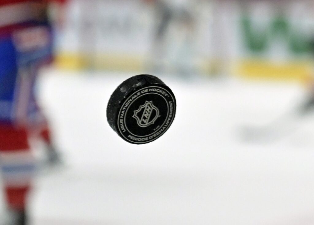 NHL puck with logo; World Junior Championship Predictions