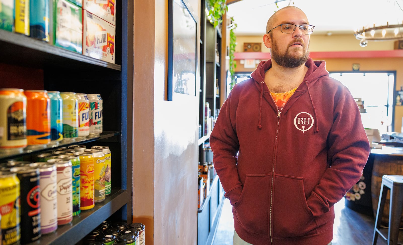 Barrel House owner Gus Stathes talks in the bar on Tuesday, Oct. 9. The bar offers a variety of THC-infused beverages, which it won't be able to sell when a ban takes effect Tuesday. An executive order signed by Ohio Gov. Mike DeWine on Oct. 8 will ban the sale of intoxicating hemp products for the next several months. BRYANT BILLING / STAFF