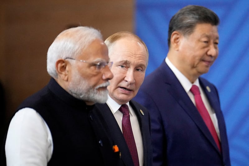FILE PHOTO: Indian Prime Minister Narendra Modi, Russian President Vladimir Putin and Chinese President Xi Jinping attend a family photo ceremony prior to the BRICS Summit plenary session in Kazan, Russia, Wednesday, Oct. 23, 2024.     Alexander Zemlianichenko/Pool via REUTERS/File Photo