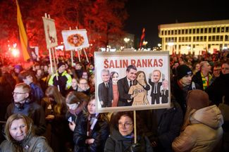 A poster showing Lithuanian politicians covering the mouths of journalists