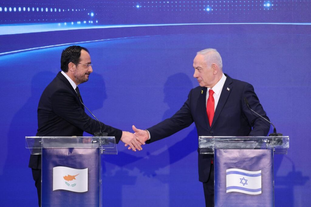 Greek Cypriot Leader Nikos Christodoulides (L) shakes hands with Israeli Prime Minister Benjamin Netanyahu during a joint press conference together with Greek Prime Minister Kyriakos Mitsotakis  (not pictured) after a trilateral meeting in Jerusalem, Israel on Dec. 22, 2025. (AFP Photo)