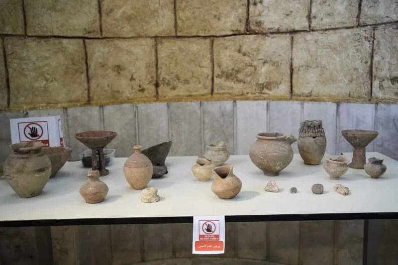 An image shows a display case in the Idlib City Museum featuring some of the 1,234 cuneiform clay tablets (dating to the third millennium BC) and 189 other artifacts that were looted or went missing from the museum during the Syrian war in 2015. Moawia Atrash/dpa