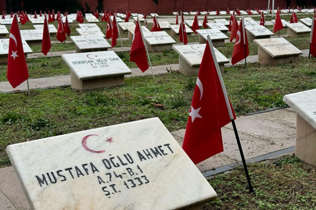 Turkish flags stand beside marble headstones at the Turkish Martyrs’ Cemetery in Bucharest, Romania, Dec. 12, 2025. (AA Photo)