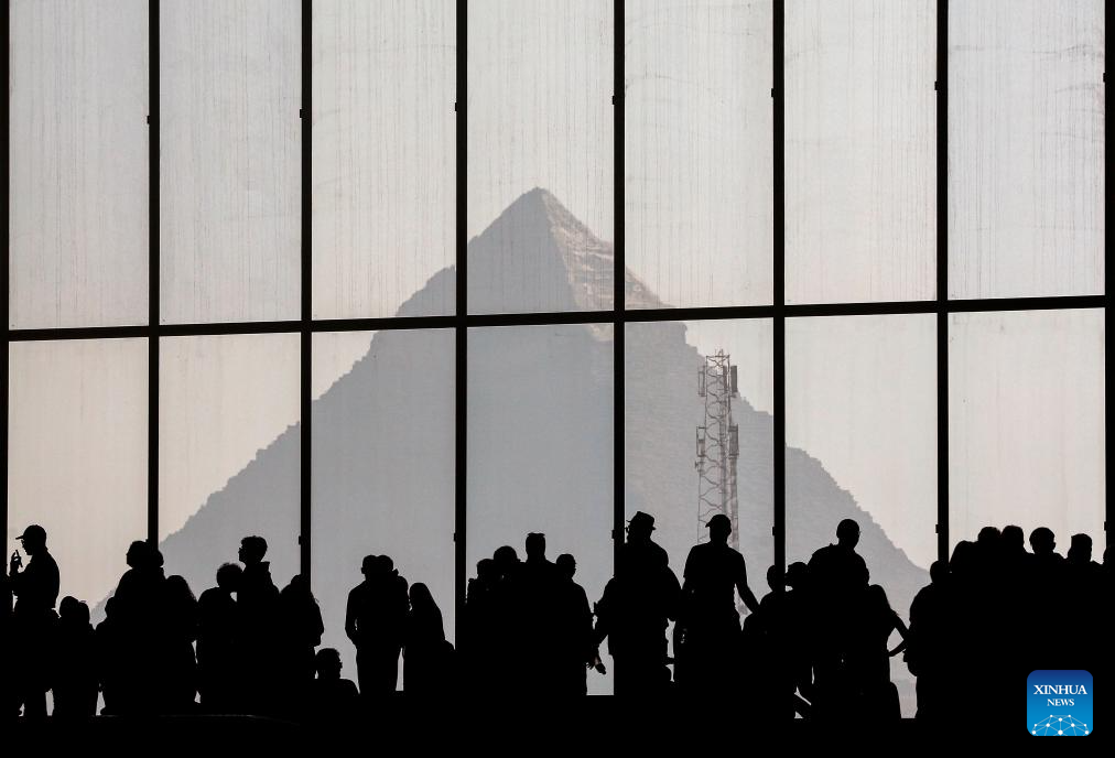 This photo shows a distant view of the Egyptian pyramid as seen from inside the Grand Egyptian Museum in the Greater Cairo, Egypt, Dec. 23, 2025. The Grand Egyptian Museum opened its doors to the public on Nov. 4, establishing itself as one of the world's largest displays of ancient relics, and a high-tech fort dedicated to heritage conservation. (Xinhua/Ahmed Gomaa)
