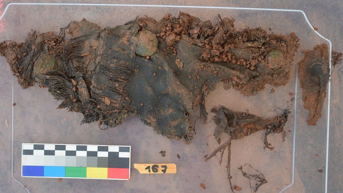 Remains of tattered uniform