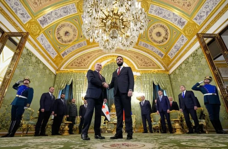Russian President Vladimir Putin and Syrian interim president Ahmed al-Sharaa shake hands during their meeting at the Grand Kremlin Palace in Moscow on October 15, 2025. (credit: ALEXANDER ZEMLIANICHENKO/POOL/AFP via Getty Images)