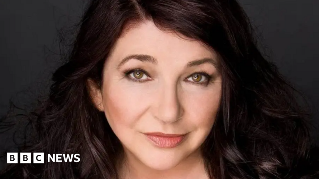 Kate Bush 'heartbroken' over friend missing at sea – BBC Kate Bush smiling at the camera. She has dark brown hair and eyes.