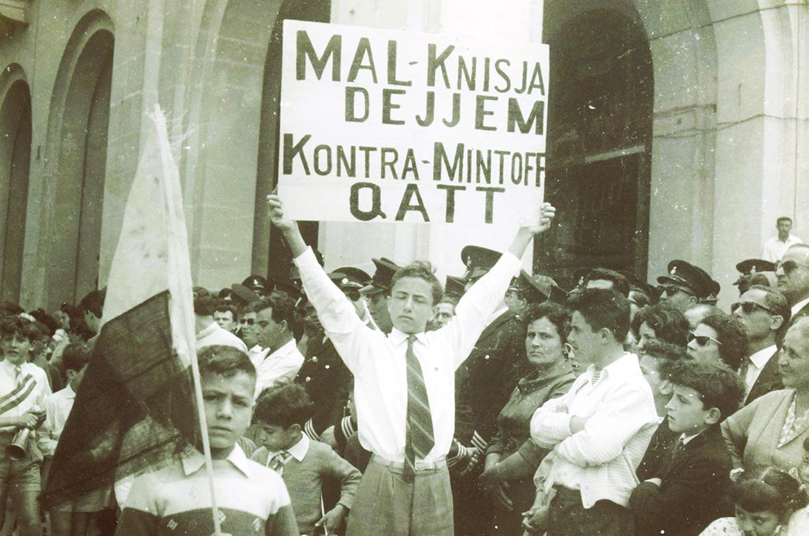 Postcard of a demonstrator during the 1960s confrontation between the Labour Party and the Church.