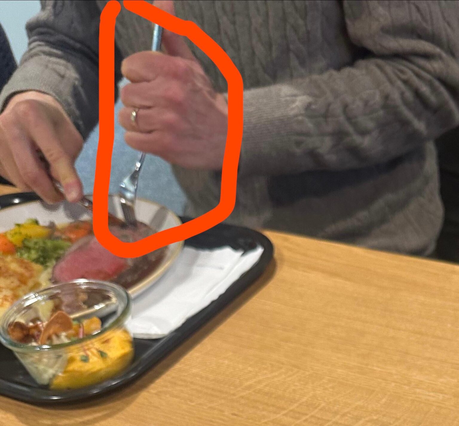 Why do so many people in Switzerland hold their fork like that?