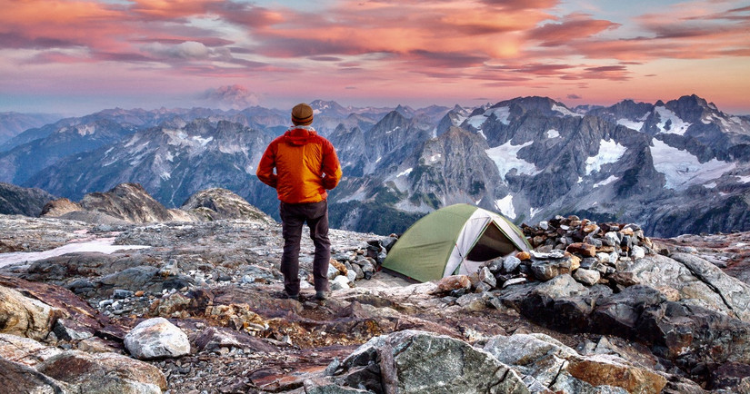 Hiker at sunset in North Cascades National Park, Washington