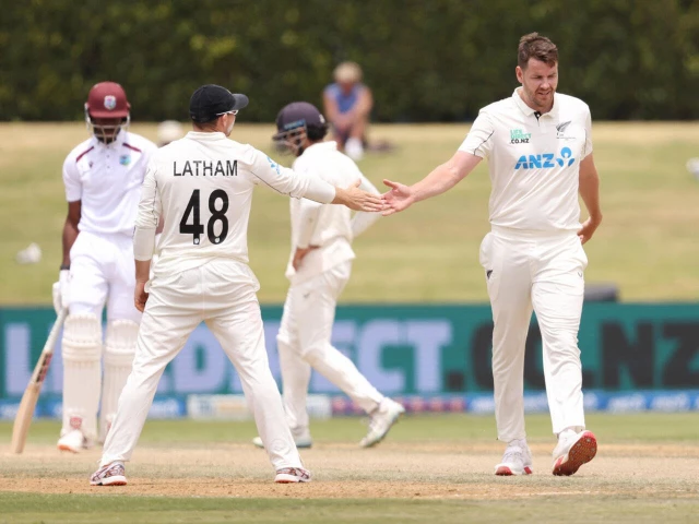 new zealand s jacob duffy and tom latham in the test match against west indies at bay oval in mount maunganui new zealand photo afp