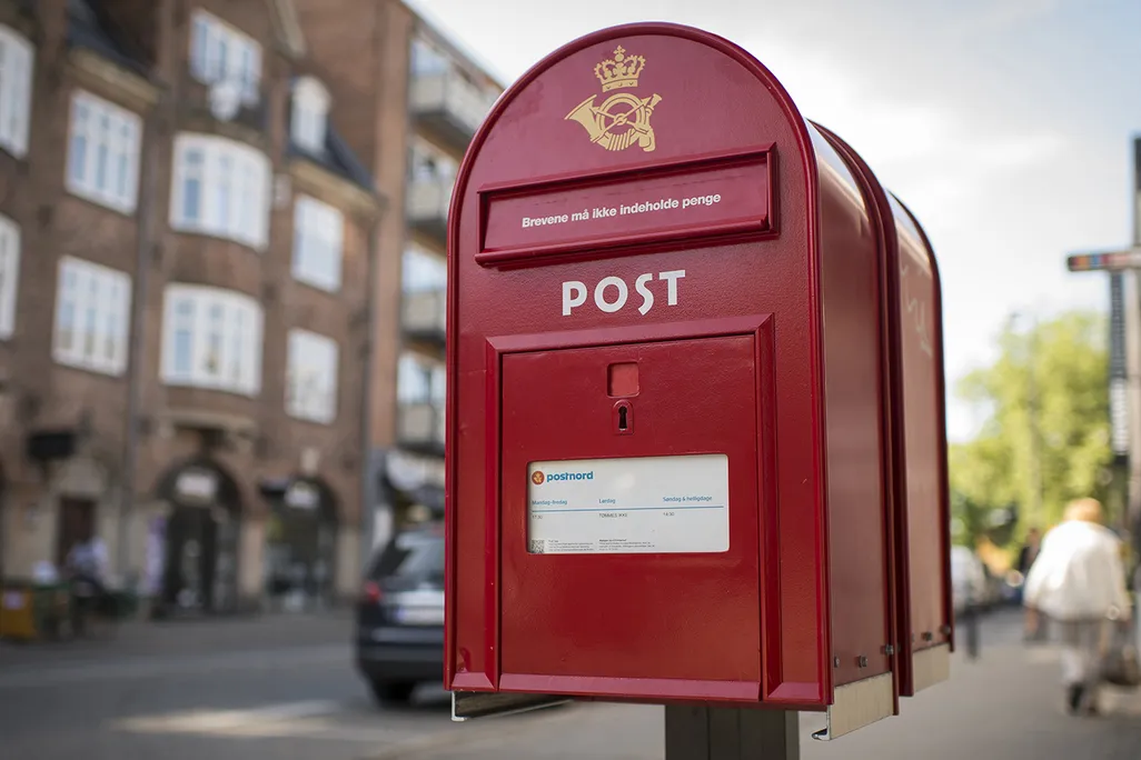 A red mailbox in the street
