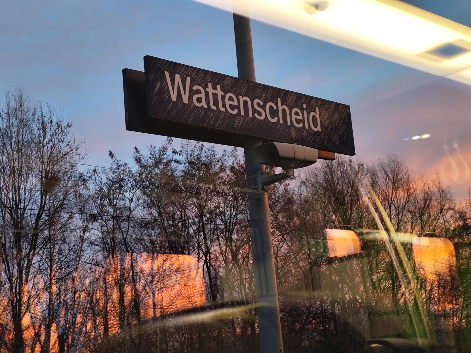 What caused these white marks on the sign?