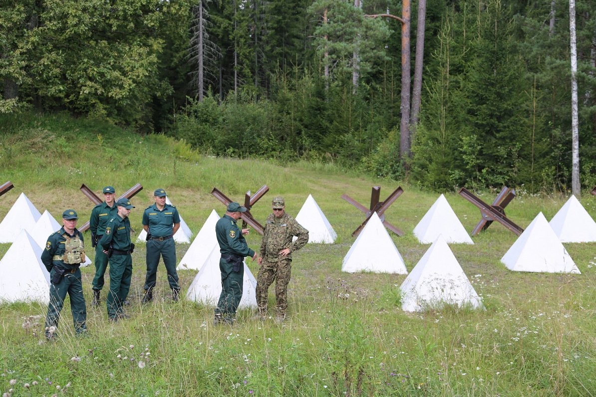 Border guards and obstacles at Latvia's border with Russia