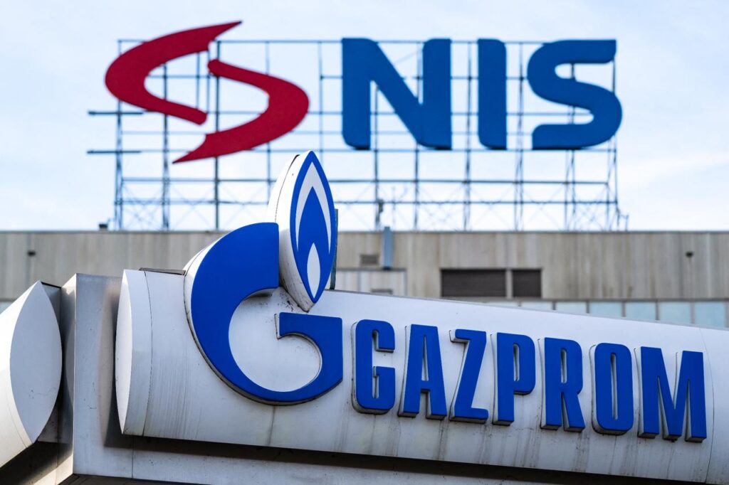 Serbia’s only oil refinery down: Is NIS shutdown the cost of Russian loyalty? This photograph shows the logo of NIS is displayed on the facade of the companys headquarters above the logo of a Gazprom gas station in Belgrade, Serbia on Nov. 25, 2025. (AFP Photo)