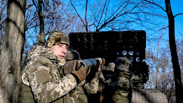 Ukrainian soldiers load a rocket launch system on the frontline on 25 December. Pic: Reuters